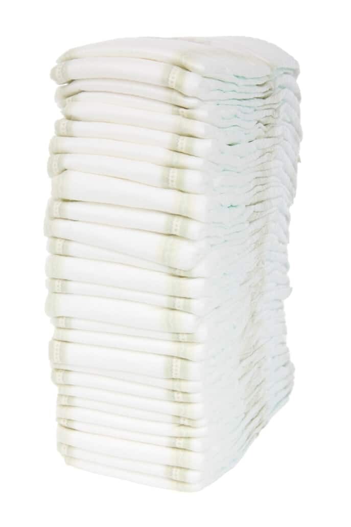stack of diapers with nonwoven construction adhesive
