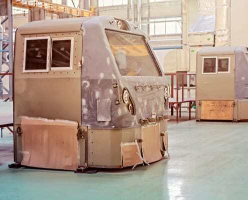 vehicle assembly using transport adhesive sealant