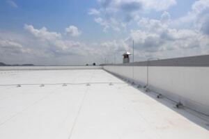 White PVC roofing membrane on flat industrial roof